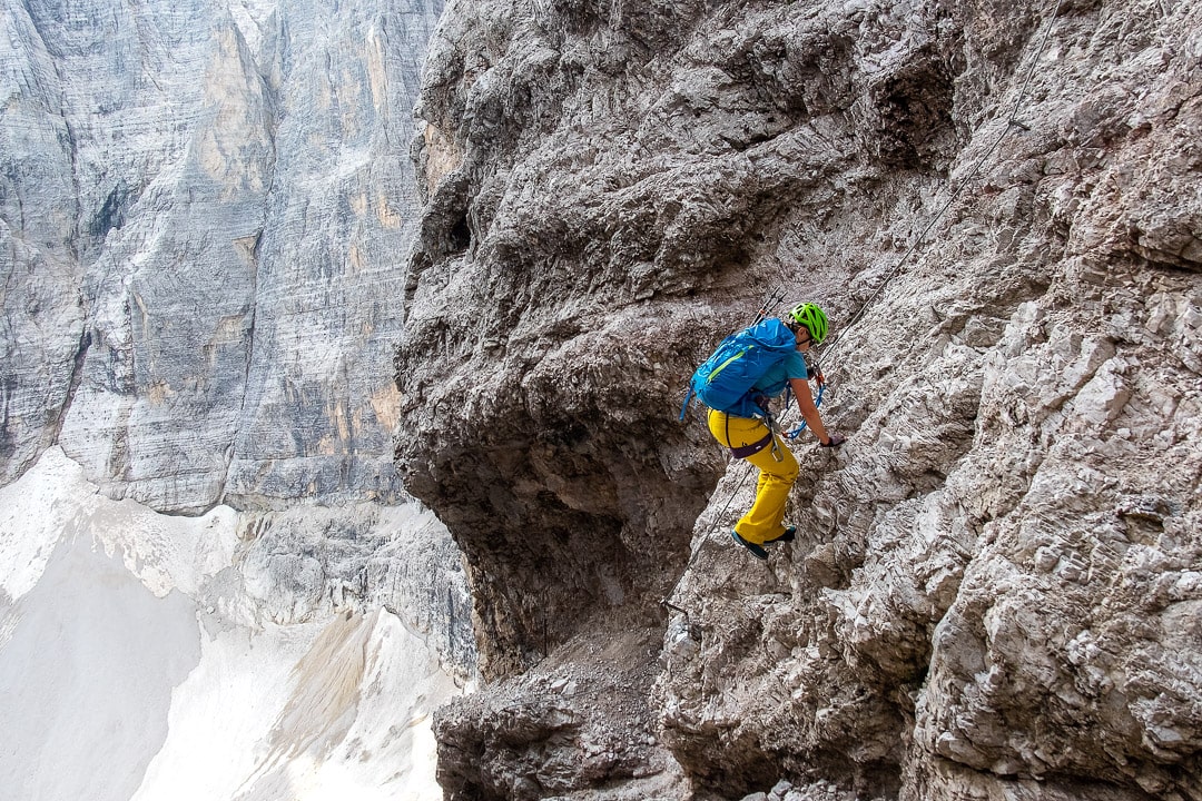 Via Ferratas in the Dolomites – equipment used by a climbing female alpinist