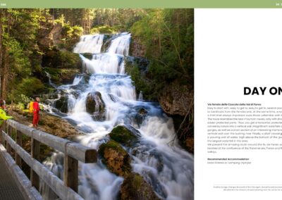 Walk into a fairytale – crossing a wooden bridge by the cascading waterfalls of the Dolomites