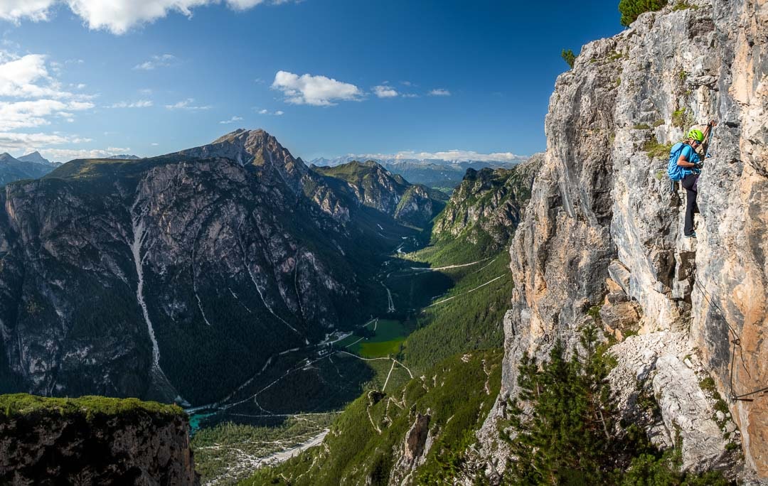 A female alpinist on a via ferrata on Monte Piana in Sesto Dolomites - eBOOK_GUIDE